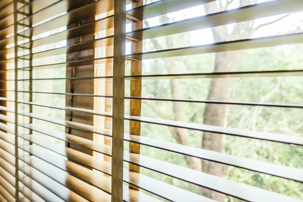 DIY shutters fitted to a UK home window showing light control and privacy